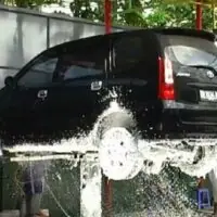 In-ground single post car lift – X shape